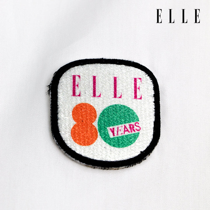 ELLE เสื้อเชิ๊ตสตรีผ้า COTTON แขนยาว ทรง CROP ติดชิ้นโลโก้ LIMITED EDITION COLLECTION ELLE 80 YEARS ที่อก รุ่น W3B392 ELLE